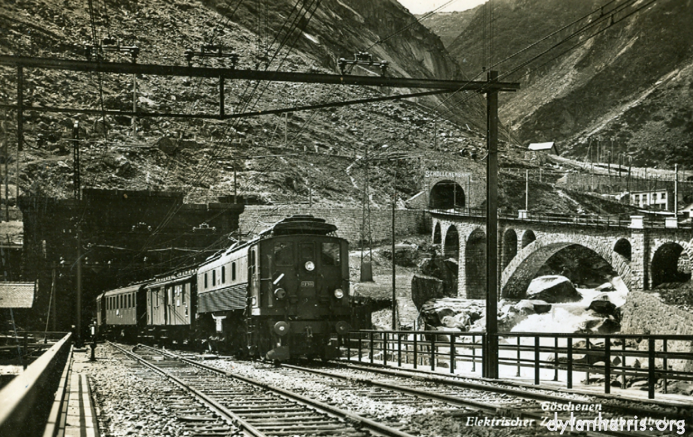 image: Postcard: Göschenen Elektrischer Zug der Gotthardbahn. [[ St. Gotthard Tunnel Göschenen Entrance with the Schöllenenbahn Rack Railway to Andermatt etc. ]]